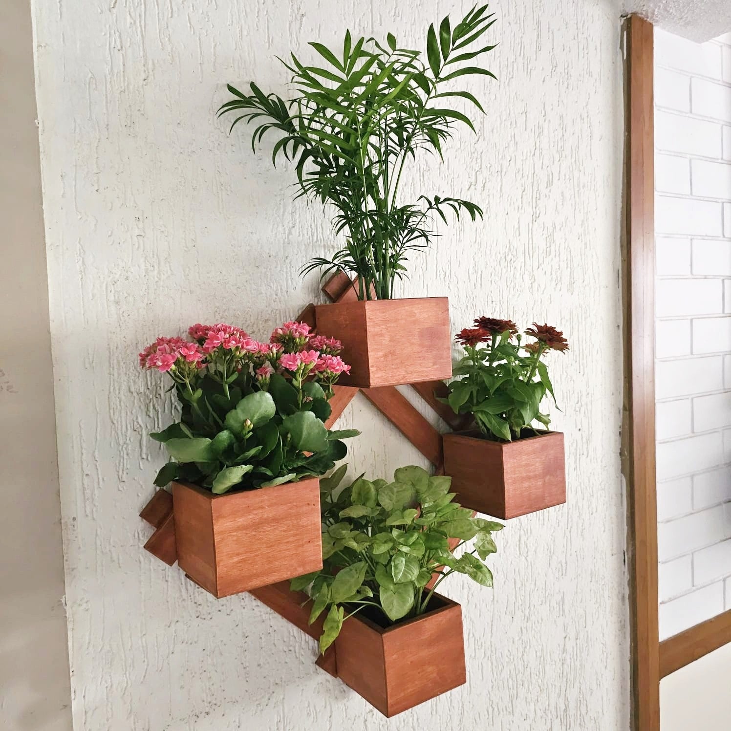 <img src="wall-mounted-planter-diamond.jpg" alt="Wall-mounted diamond-shaped planter, perfect for adding a contemporary touch to indoor or outdoor decor.">