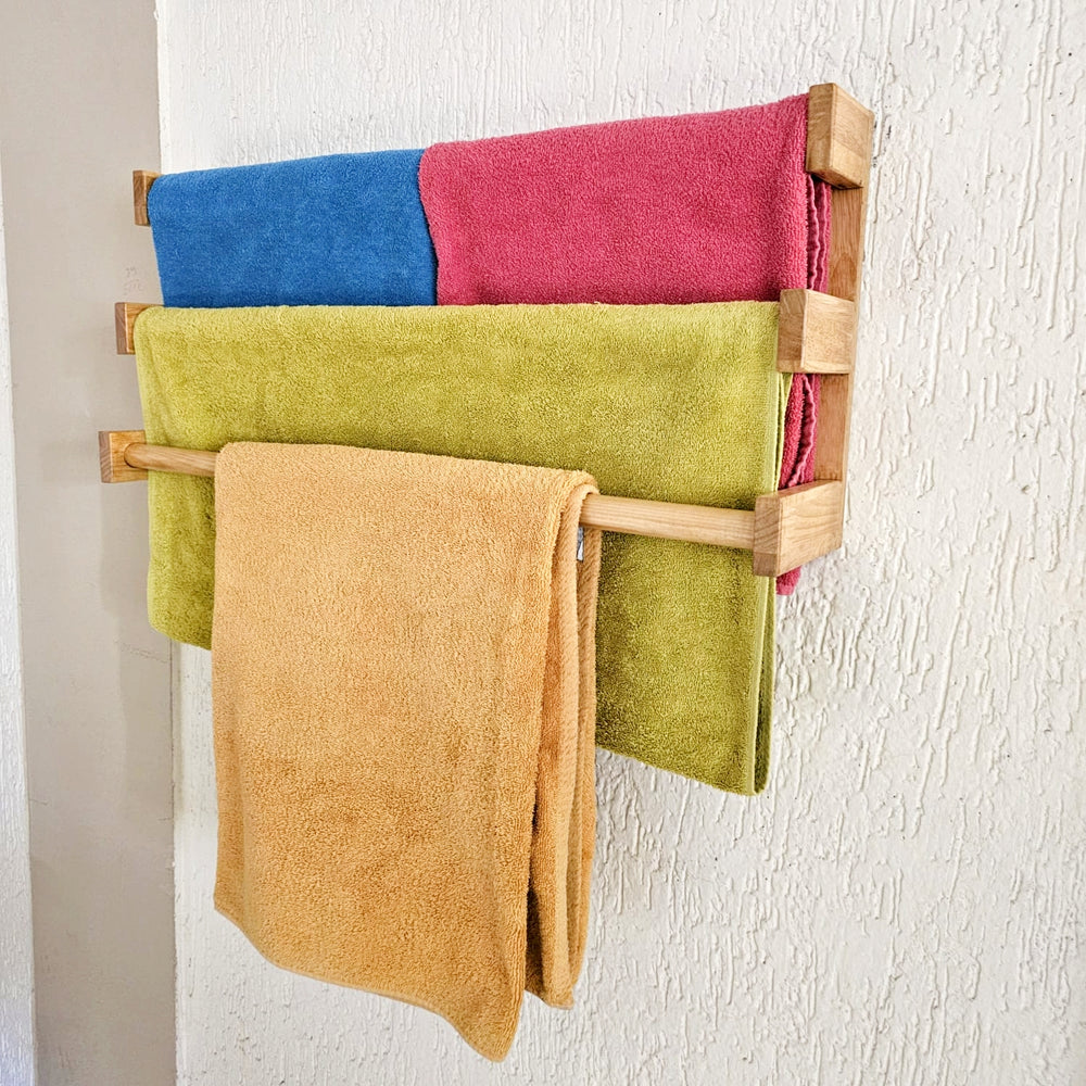 <img src="towel-holder-large.jpg" alt="Large towel holder from Barish Home Decor, designed to organize towels with a sleek and durable wooden frame.">