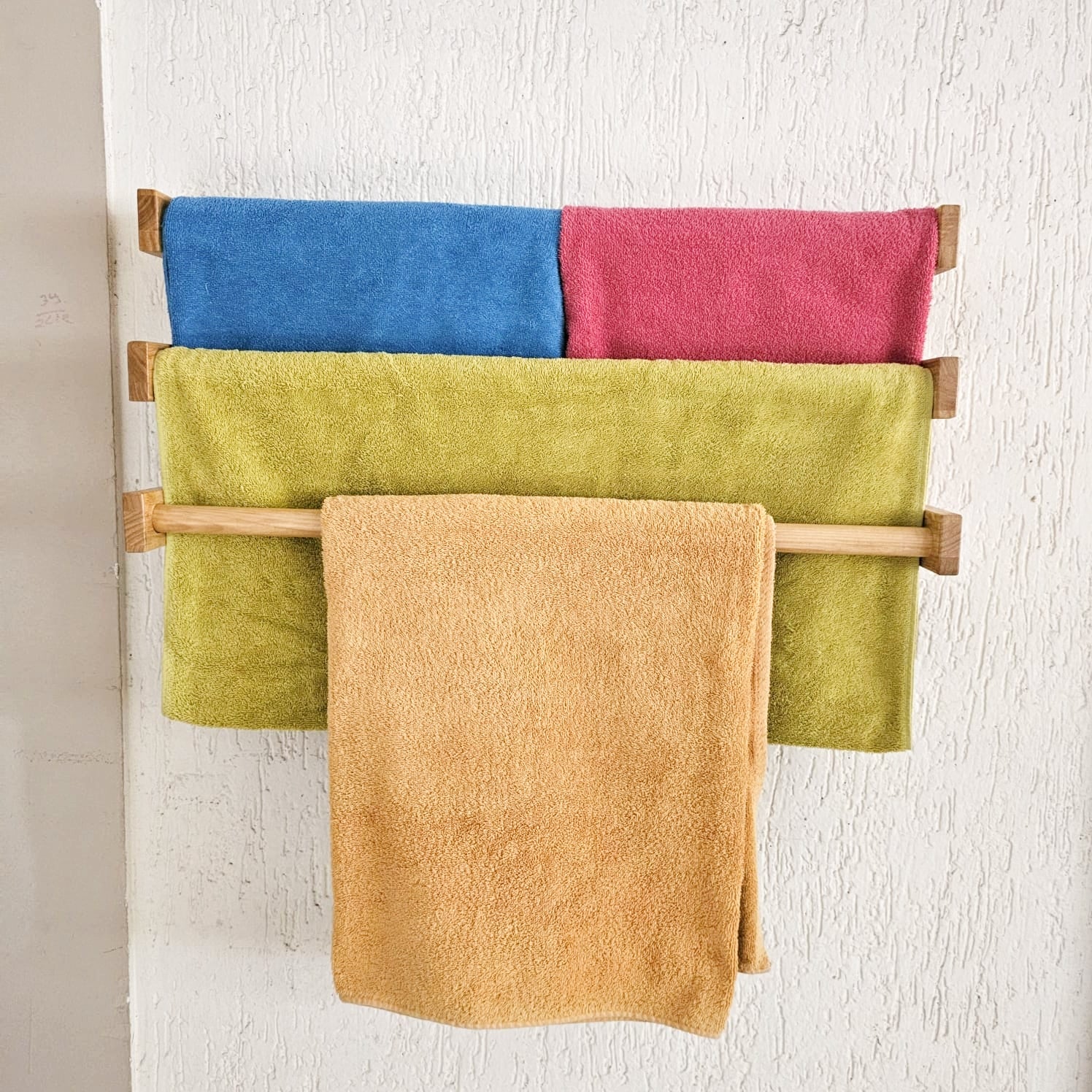 <img src="towel-holder-large.jpg" alt="Large towel holder from Barish Home Decor, designed to organize towels with a sleek and durable wooden frame.">