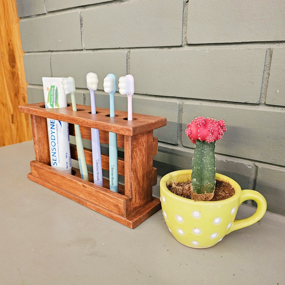 <img src="toothbrush-holder-slim.jpg" alt="Slim wooden toothbrush holder for organizing toothbrushes in a compact and stylish way.">
