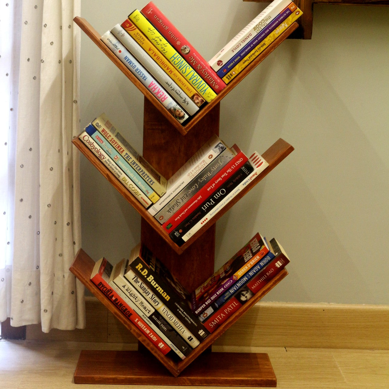 <img src="book-stand-dark-brown.jpg" alt="Dark brown wooden book stand, perfect for organizing and displaying books in style.">
