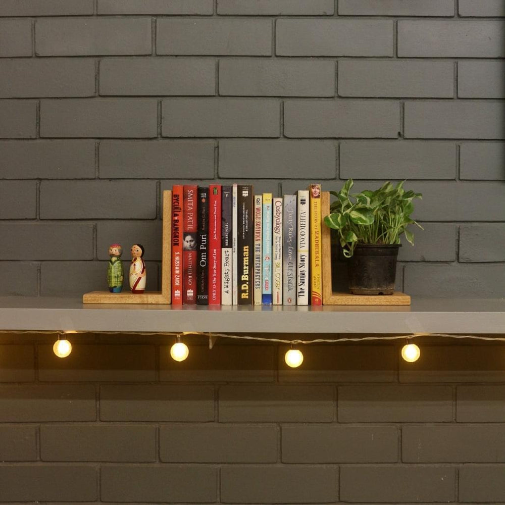 <img src="book-ends.jpg" alt="Wooden bookends made from full wood, designed to keep your books organized and secure on shelves. Stylish and sturdy, perfect for home or office decor.">