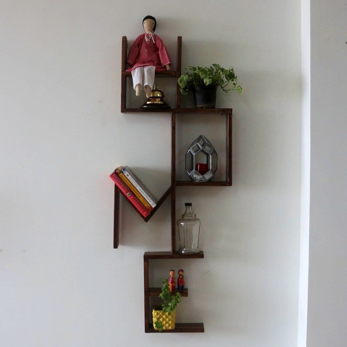 <img src="home-wall-shelve-barish-decor.jpg" alt="Stylish and functional wall shelf for home decor, perfect for displaying books, plants, or decorative items.">
