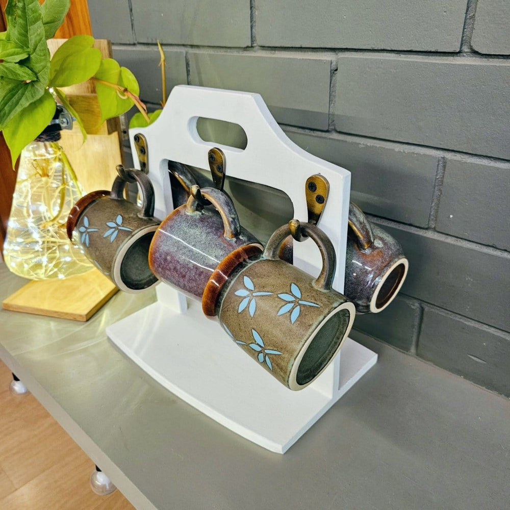 <img src="mug-holder-5-mugs.jpg" alt="Stylish mug holder with space for 5 mugs, designed to organize and display your favorite mugs in a neat and accessible manner. Ideal for kitchens or coffee stations.">