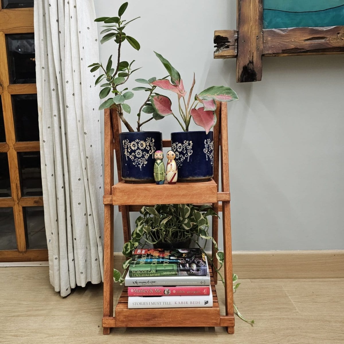 <img src="multi-purpose-stand.jpg" alt="Handcrafted small wooden multi-purpose floor-standing stand, dust-proof and spacious, designed for various uses and storage needs.">