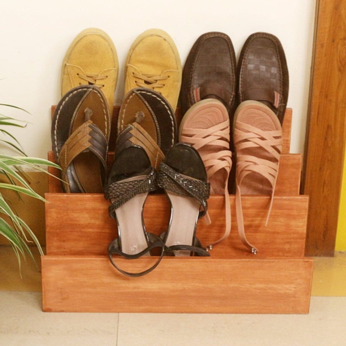 <img src="shoe-rack.jpg" alt="Wooden shoe rack from Barish Home Decor, designed for organizing shoes in a stylish and space-saving way.">