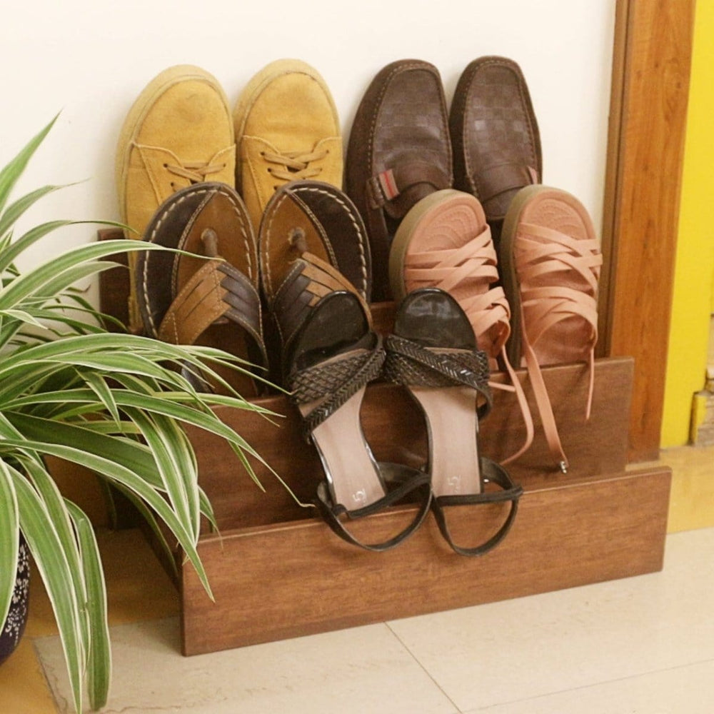 <img src="shoe-rack.jpg" alt="Wooden shoe rack from Barish Home Decor, designed for organizing shoes in a stylish and space-saving way.">