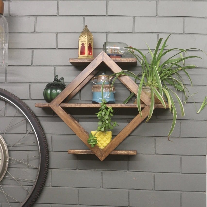 <img src="wall-shelve-diamond-barish-home-decor.jpg" alt="Diamond-shaped wall shelf, a stylish and functional piece perfect for organizing decor items or small plants with a modern touch.">
