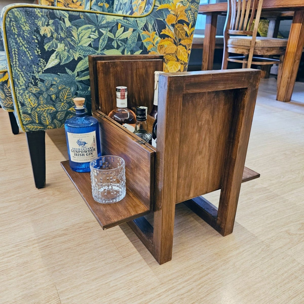 <img src="side-table-with-mini-bar.jpg" alt="Handmade wooden side table with a built-in mini bar cabinet, offering a spacious and stylish solution for living room storage and decor.">
