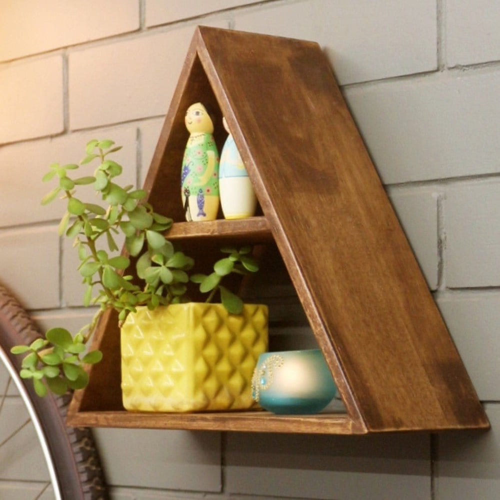 <img src="wall-shelf-triangular-c.jpg" alt="Stylish triangular wall shelf that adds a modern touch to your space, perfect for displaying books or decorative items.">